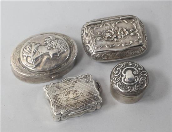 A Victorian silver vinaigrette and three assorted silver pill boxes.